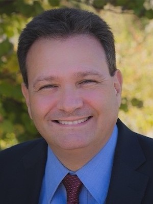 Headshot of Dr. Abdennour Smiling Outside