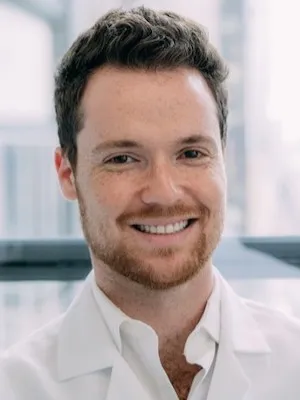 Headshot of Dr. Jakob Smiling in the Office